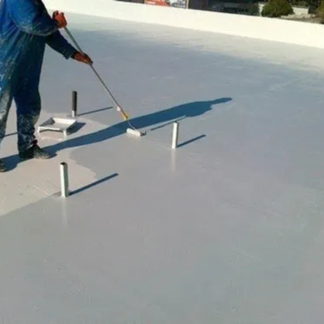 Application of Seal Guard Rubber Roof paint on a concrete roof with a paint roller by a Trusted Painters Technician, a light grey rubber roof paint is used for reflection.